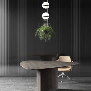 Inserto de piel con costura vista en la mesa Trilo