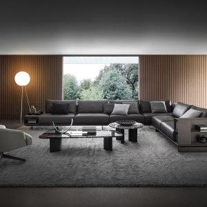 Sofá modular Asso de i4Mariani con volúmenes en piel y base sobre pies de titanio