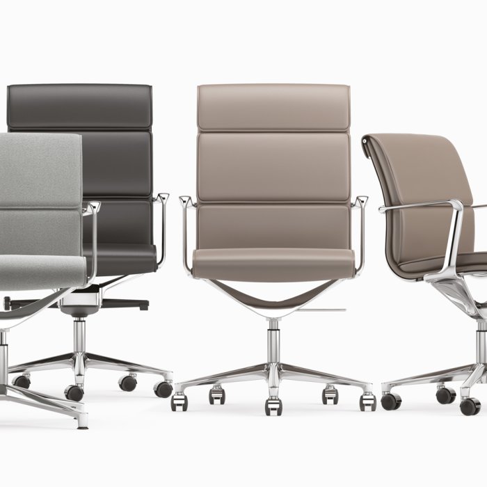 Sillón de dirección italiano en piel cognac tras la mesa de un despacho profesional en la Castellana de Madrid